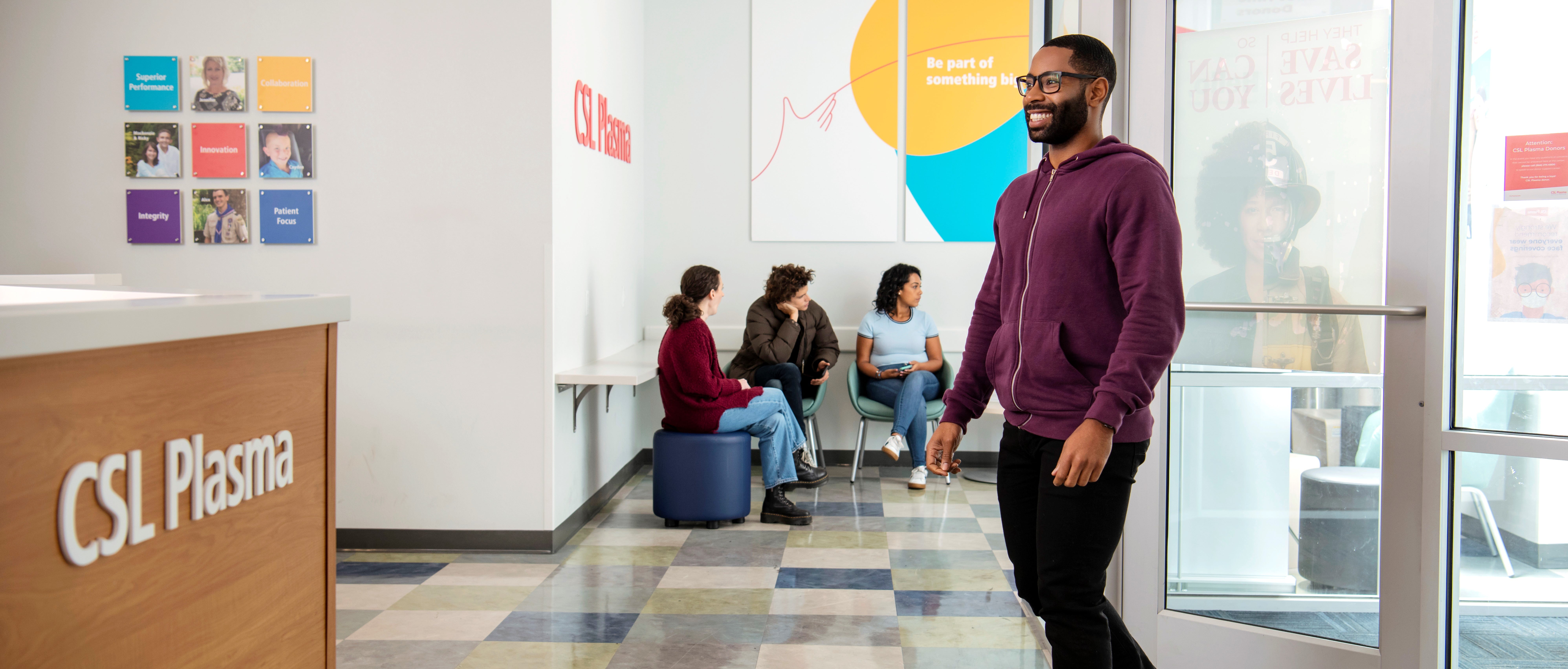 Man walking into a CSL Plasma center